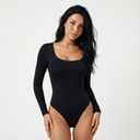 Black long-sleeve sculpting bodysuit with a scoop neckline and high-cut leg. Smooth, flattering, and perfect for layering or wearing solo.